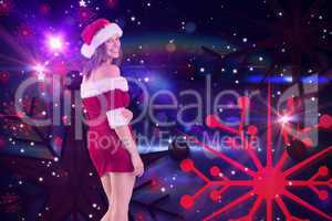 Composite image of pretty girl in santa outfit smiling at camera
