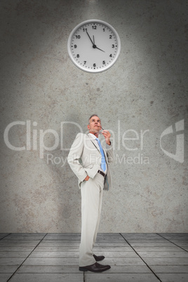 Composite image of thinking businessman