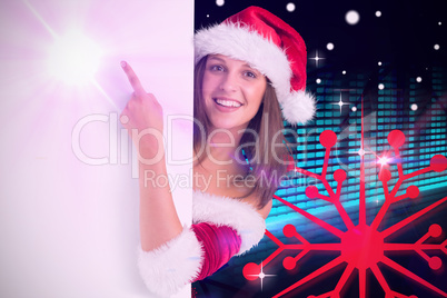 Composite image of pretty girl in santa costume showing card