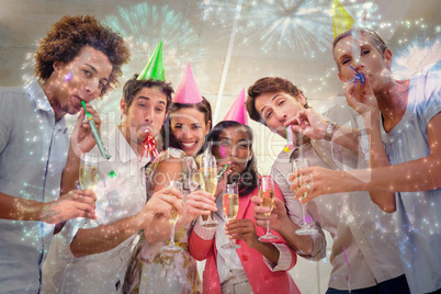 Composite image of business people celebrating at the workplace