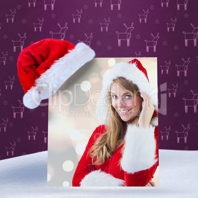 Composite image of festive blonde smiling at camera