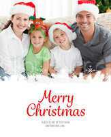 Composite image of portrait of a happy family with christmas hat