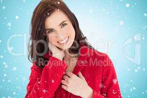 Composite image of portrait of a happy brunette in red coat