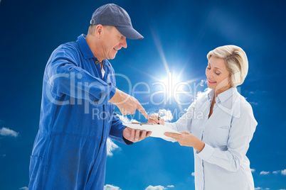 Composite image of happy delivery man with customer