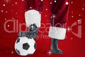 Composite image of santa claus is playing soccer