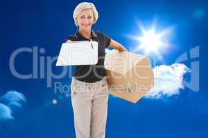 Composite image of happy delivery woman looking for signature