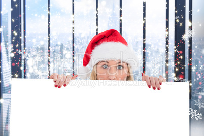 Composite image of festive blonde showing white poster