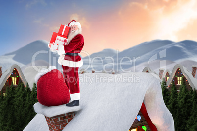 Composite image of santa on cottage roof