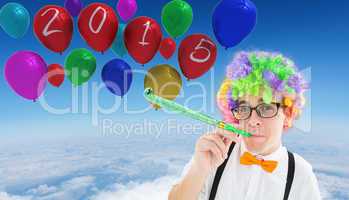 Composite image of geek blowing party horn