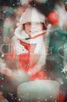 Composite image of festive little boy smiling at camera