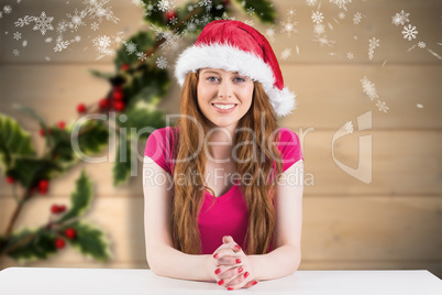 Composite image of festive redhead smiling at camera