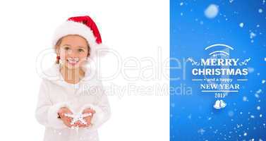 Composite image of festive little girl holding snowflake