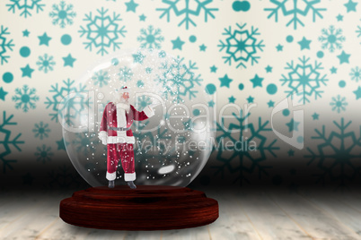 Santa presenting in a snow globe