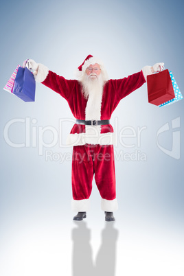 Santa holds some bags for chistmas