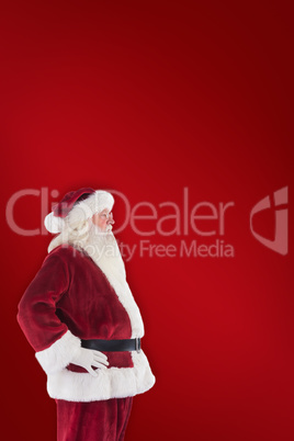 Composite image of santa claus shows his side to camera