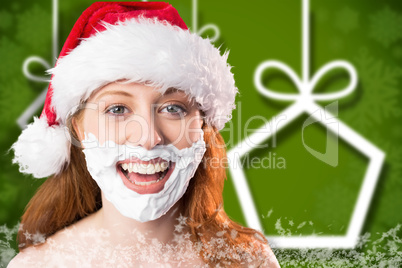 Composite image of festive redhead in foam beard