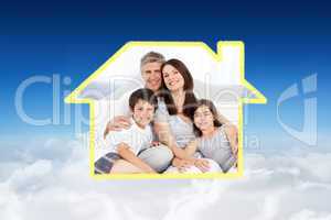 Composite image of family sitting on a bed