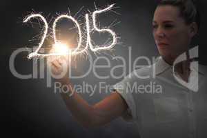 Composite image of businesswoman touching spark