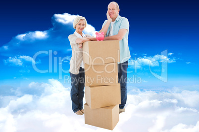 Composite image of older couple smiling at camera with moving bo