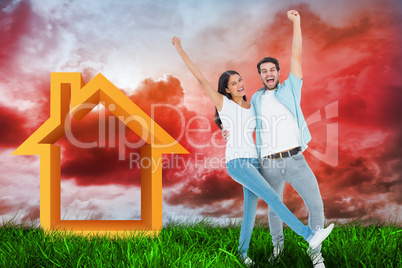 Composite image of happy casual couple cheering together