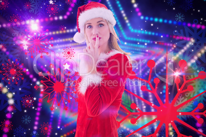 Composite image of festive blonde keeping a secret