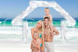 Composite image of happy family on the beach