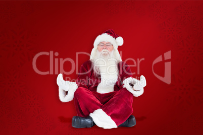 Composite image of santa claus sits and meditates