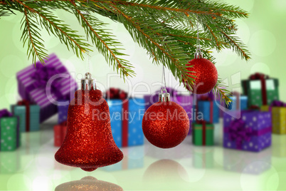 Composite image of red decorations on branch