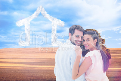 Composite image of attractive young couple smiling at camera