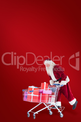 Composite image of santa rides on a shopping cart