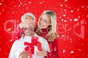 Composite image of loving couple with gift