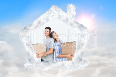 Composite image of wife and husband carrying boxes in their new