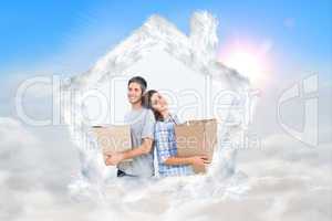 Composite image of wife and husband carrying boxes in their new