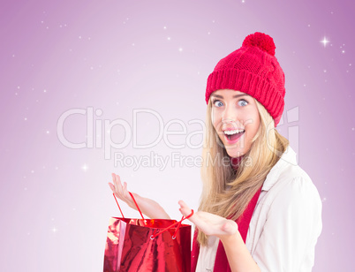 Happy blonde opening gift bag