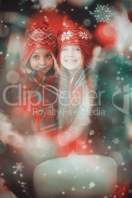 Composite image of festive little girls under a blanket