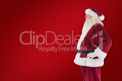 Composite image of santa claus shows his side to camera