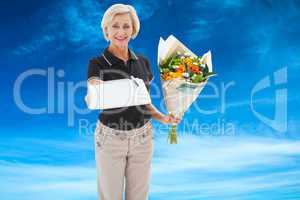 Composite image of happy flower delivery woman looking for signa
