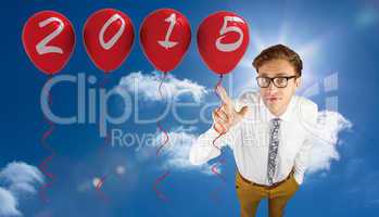 Composite image of young geeky businessman pointing to camera