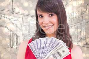 Composite image of brunette showing fan of dollars