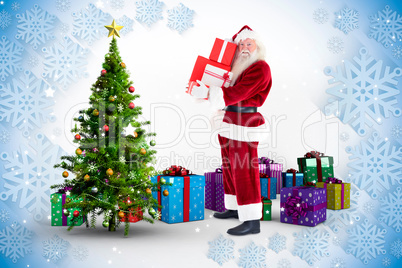 Composite image of santa carries a few presents