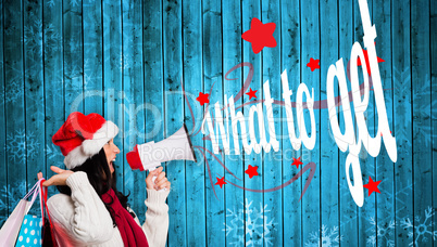 Composite image of woman holding some shopping bags