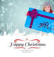 Composite image of composite image of happy blonde in winter clo