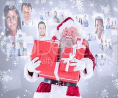 Composite image of santa carries a few presents