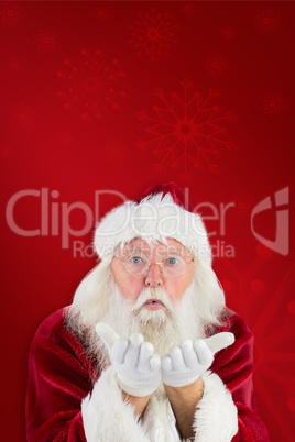 Composite image of santa claus blows something away