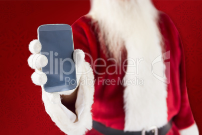 Composite image of santa claus showing smartphone