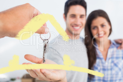 Composite image of man being given a house key