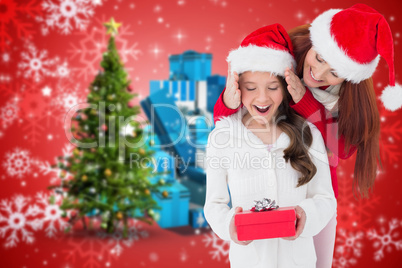 Composite image of mother and daughter with gift