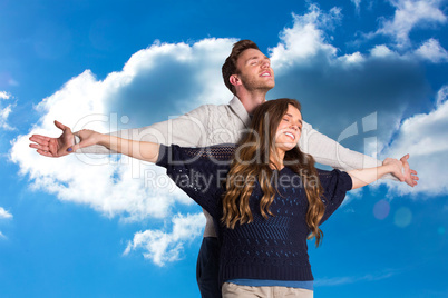 Composite image of romantic young couple with arms out