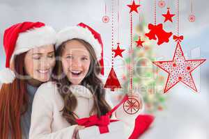 Composite image of mother and daughter opening gift