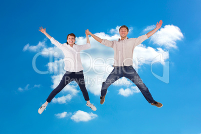 Composite image of couple jumping and holding hands